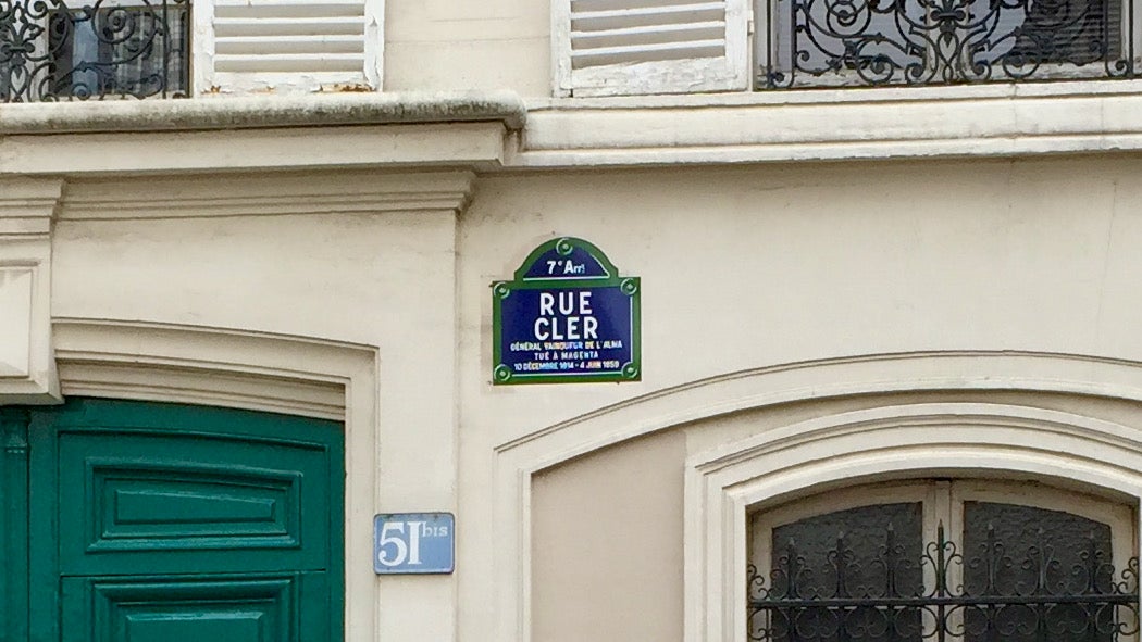 The enamel street sign for Rue Cler in the Seventh Arrondissement of Paris